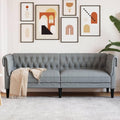 Sofa mit Armlehnen und Knopfheftung